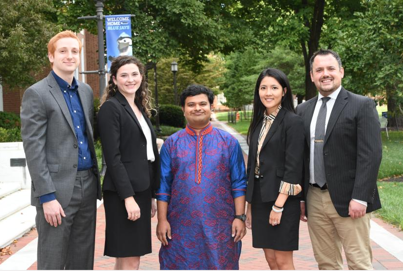 Photo of five Siebel Scholar winners outside on the Johns Hopkins Homewood campus.